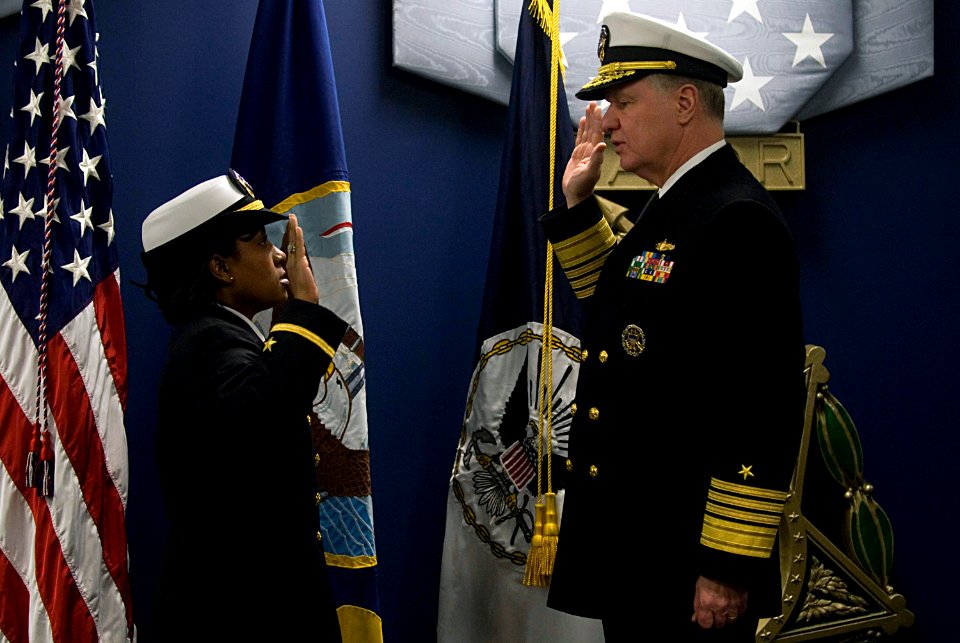 US Navy 080131-N-8273J-403 Adm. Gary Roughead, Chief of Naval Operations, administers the oath of office to Yeoman 1st Class Tennille Hairston during a commissioning ceremony in the Hall of Heroes at the Pentagon