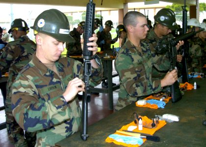 US Navy 080126-N-1205P-122 Seabees assigned to Naval Mobile Construction Battalion (NMCB) 5, Charlie Co., clean their M16A2 service rifle