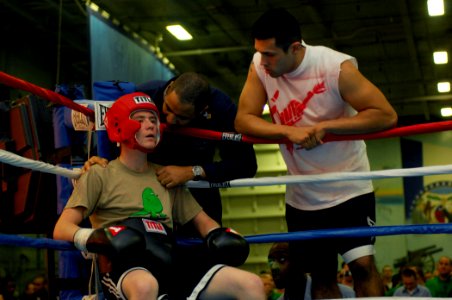 US Navy 080127-N-2984R-012 Information Systems Technician 2nd Class Nicholas Chubb receives instructions from his corner during Smokers, a boxing match held in the hangar bay aboard the Nimitz-class aircraft carrier USS Harry S