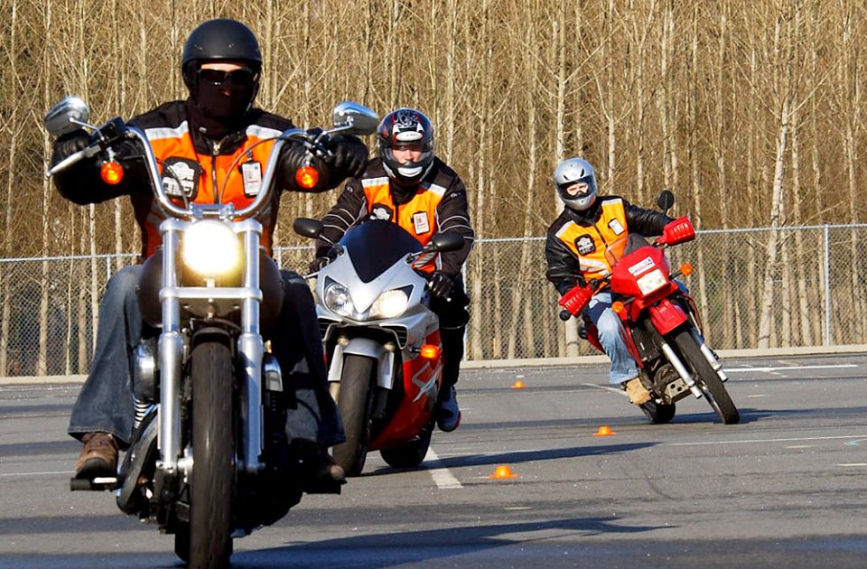 US Navy 080131-N-2143T-001 Sailors from Naval Base Kitsap practice turning and maneuvering in an empty parking lot at Naval Undersea Warfare Center (NUWC) Keyport as part of a two-day basic rider course