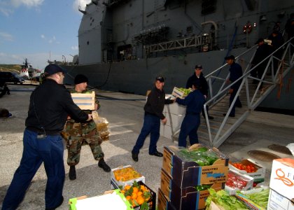 US Navy 080128-N-0780F-006 Sailors move fresh fruits and vegetables onto the Ticonderoga-class guided-missile cruiser USS San Jacinto (CG 56) during a routine port visit