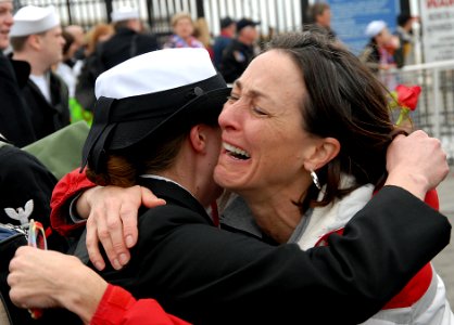 US Navy 080201-N-1831S-167 A Sailor from the amphibious assault ship USS Kearsarge (LHD 3) embraces her mother after returning from a six-month deployment as part of the Kearsarge Expeditionary Strike Group (ESG)