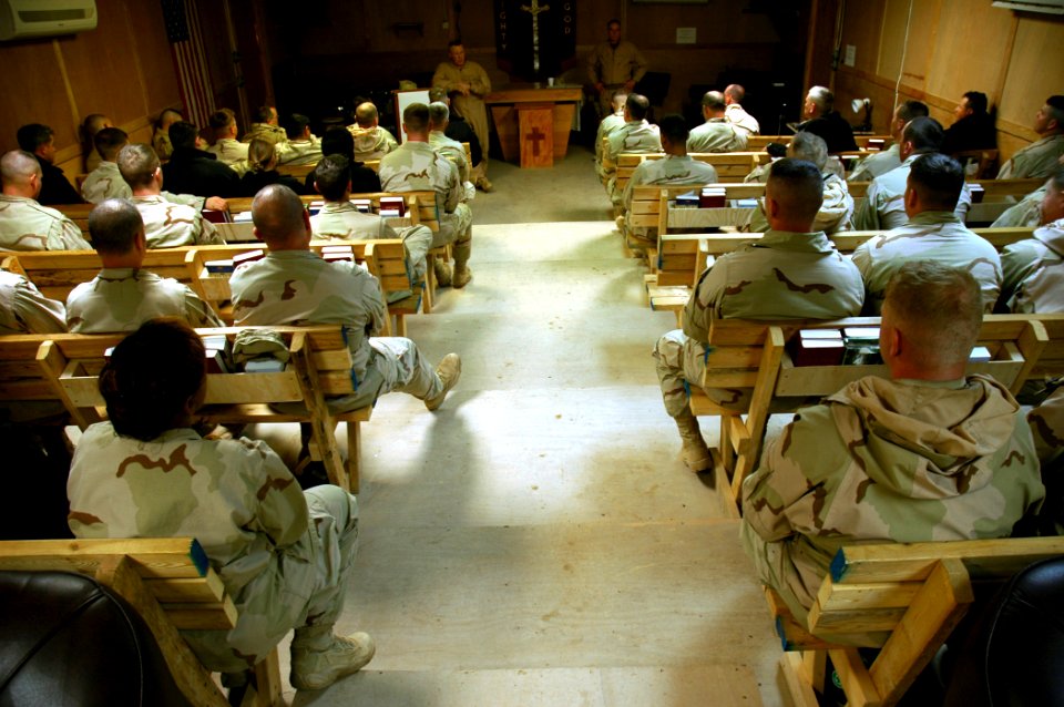 US Navy 080202-N-7367K-004 Cmdr. Steven Wolfe, left, commanding officer of U.S. Naval Mobile Construction Battalion (NMCB) 15, and Master Chief Equipment Operator Carl Carder speak with Seabees in Task Force Sierra about upcomi