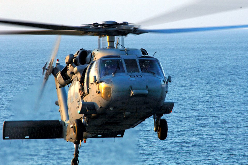 US Navy 080206-N-8335D-174 An MH-60S Seahawk assigned to Helicopter Sea Combat Squadron (HSC) 21 lands on the amphibious assault ship USS Tarawa (LHA 1)