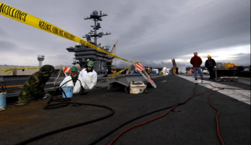 US Navy 080208-N-6538W-019 Civilian yard workers from Puget Sound Naval Shipyard perform maintenance on the bow catapults of the Nimitz-class aircraft carrier USS John C. Stennis (CVN 74)