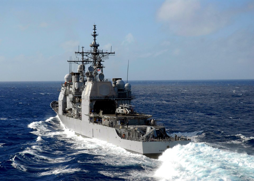US Navy 080202-N-8421M-051 The guided-missile cruiser USS Princeton (CG 59) moves off after receiving fuel from the aircraft carrier USS Nimitz (CVN 68)