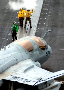 US Navy 080129-N-7571S-007 An Aviation Boatswain's Mate (Handling) directs an EA-6B Prowler, assigned to the