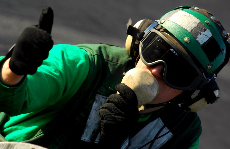 US Navy 080207-N-2984R-494 Aviation Boatswain's Mate (Equipment) 3rd Class Dana Miller, a flight deck jet blast deflector operator aboard the Nimitz-class aircraft carrier USS Harry S. Truman (CVN 75)