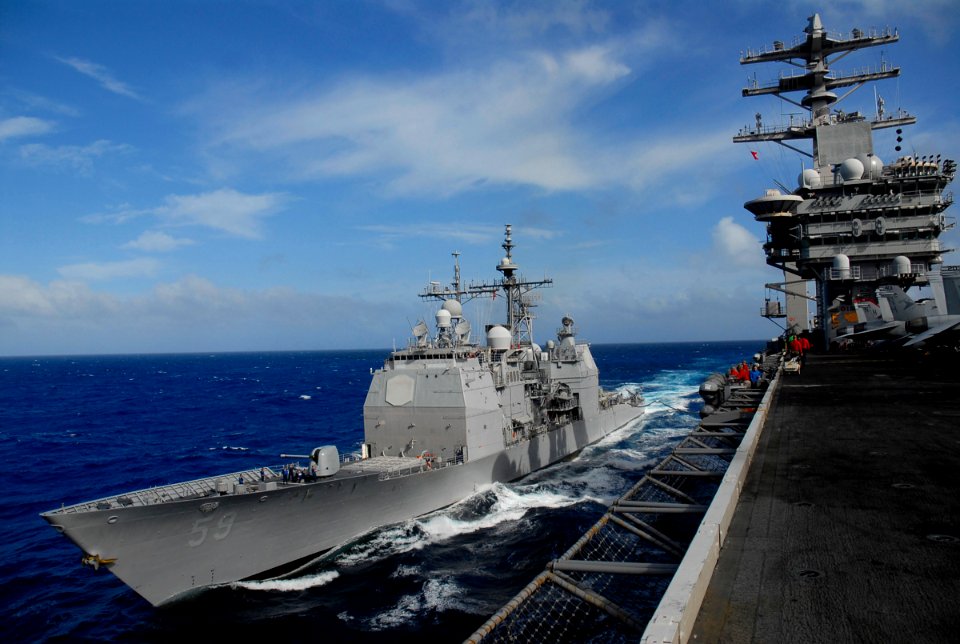 US Navy 080202-N-8421M-011 The guided-missile cruiser USS Princeton (CG 59) steams alongside the aircraft carrier USS Nimitz (CVN 68) while taking on fuel during a replenishment at sea