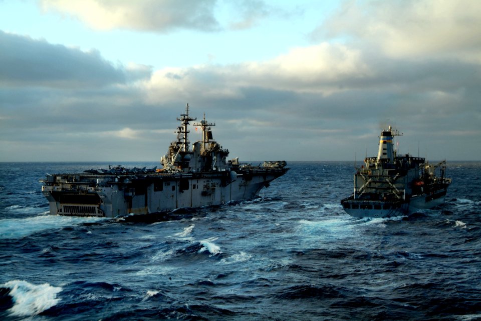 US Navy 080206-N-0807W-041 ) The amphibious assault ship USS Essex (LHD 2) and the Military Sealift Command fleet replenishment oiler USNS Pecos (T-AO 197) steam together during a refueling at sea