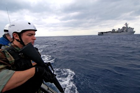 US Navy 080205-N-0807W-023 Quartermaster 3rd Class Russel J. Howell, assigned to the visit, board, search and seizure (VBSS) team from the dock landing ship USS Harpers Ferry (LSD 49)