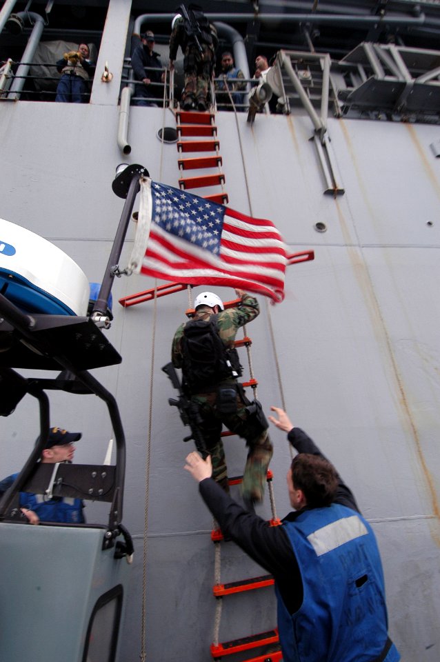 US Navy 080205-N-0807W-020 Sailors assigned to the visit, board, search and seizure team from the dock landing ship USS Harpers Ferry (LSD 49) board the Military Sealift Command fleet replenishment oilier USNS Pecos (T-AO 197)