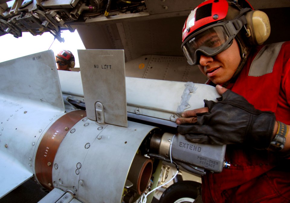 US Navy 080206-N-2984R-064 An aviation ordinanceman works on the launch mechanism of an AGM-65 Maverick air-to-surface missile aboard the Nimitz-class aircraft carrier USS Harry S. Truman (CVN 75)