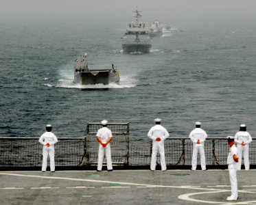 US Navy 080202-N-8933S-003 Africa Partnership Station (APS) Sailors watch as landing craft utility (LCU) 1655 leads a formation of the Equatorial Guinea Navy behind the APS flagship, the dock landing ship USS For