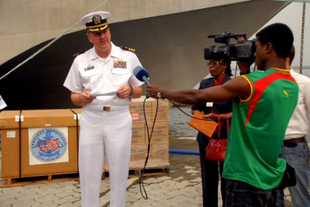 US Navy 080211-N-0193M-096 Cmdr. Charles Rock, commanding officer of the Africa Partnership Station (APS) high speed vessel Swift (HSV 2), speaks with the press about the delivery of 27 pallets photo