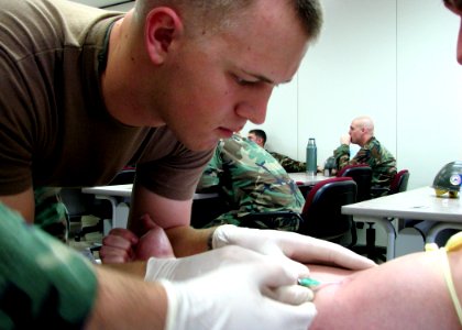 US Navy 080201-N-8547M-012 Builder 2nd Class Lance D. Fairchild assigned to Naval Mobile Construction Battalion (NMCB) 5 participates in combat lifesaver training