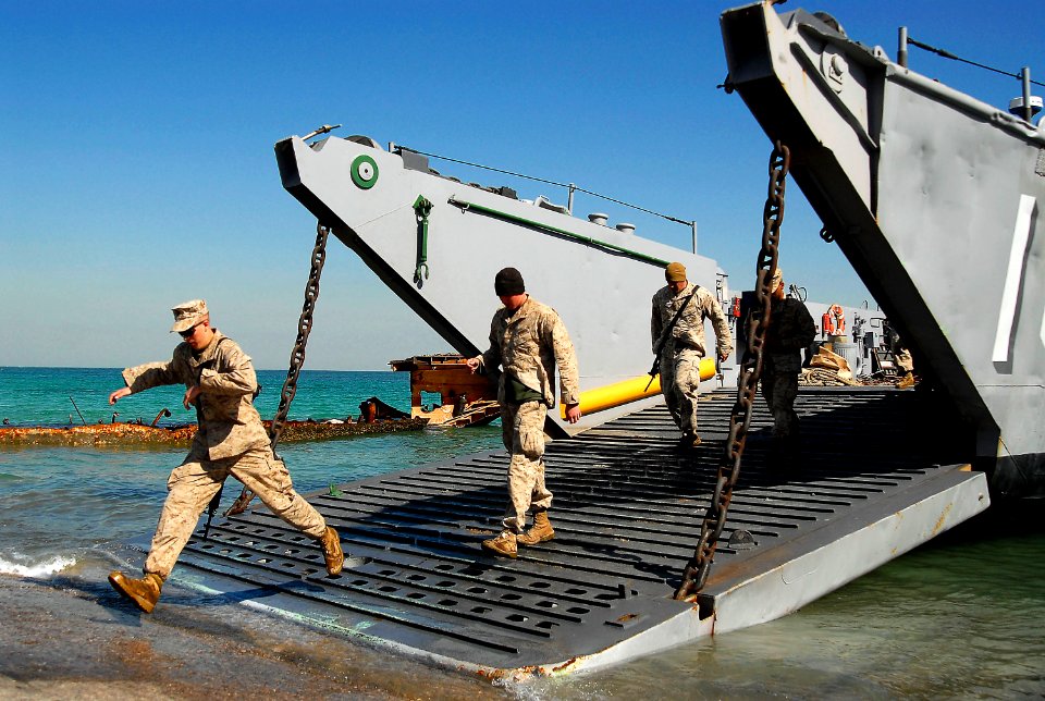 US Navy 080204-N-4774B-381 Marines of the 11th Marine Expeditionary Unit debark from a landing craft utility (LCU) that brought them from the amphibious assault ship USS Tarawa (LHA 1)