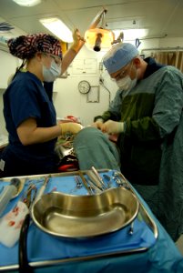 US Navy 080207-N-6326B-163 Hospitalman Anna Lupson, left, and Lt. Jose Suris extract a wisdom tooth in the dental ward of the nuclear-powered aircraft carrier USS Nimitz (CVN 68)