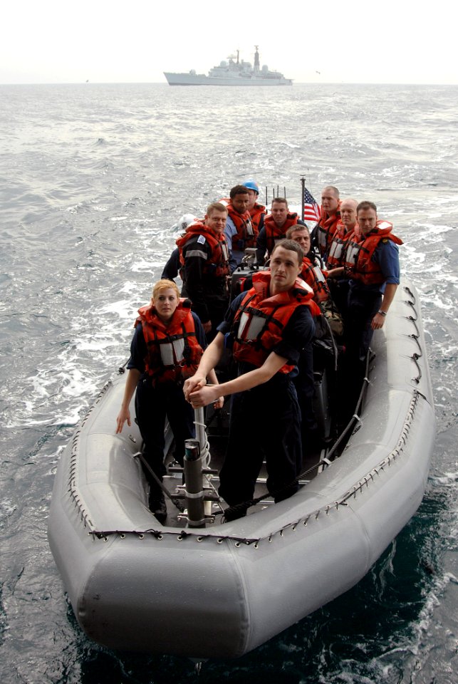 US Navy 080213-N-8923M-005 American Sailors ride a rigid hulled inflatable boat from the British destroyer HMS Manchester (D95) to the stern dock of the Nimitz-class aircraft carrier USS Harry S. Truman (CVN 75) after participa