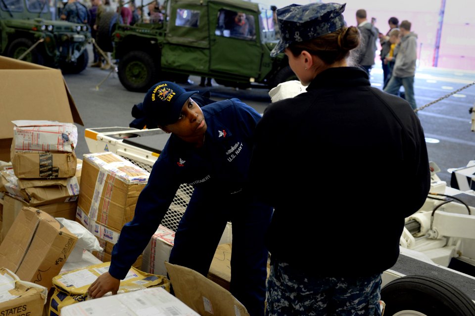 USS America mail call 140824-N-LD343-005