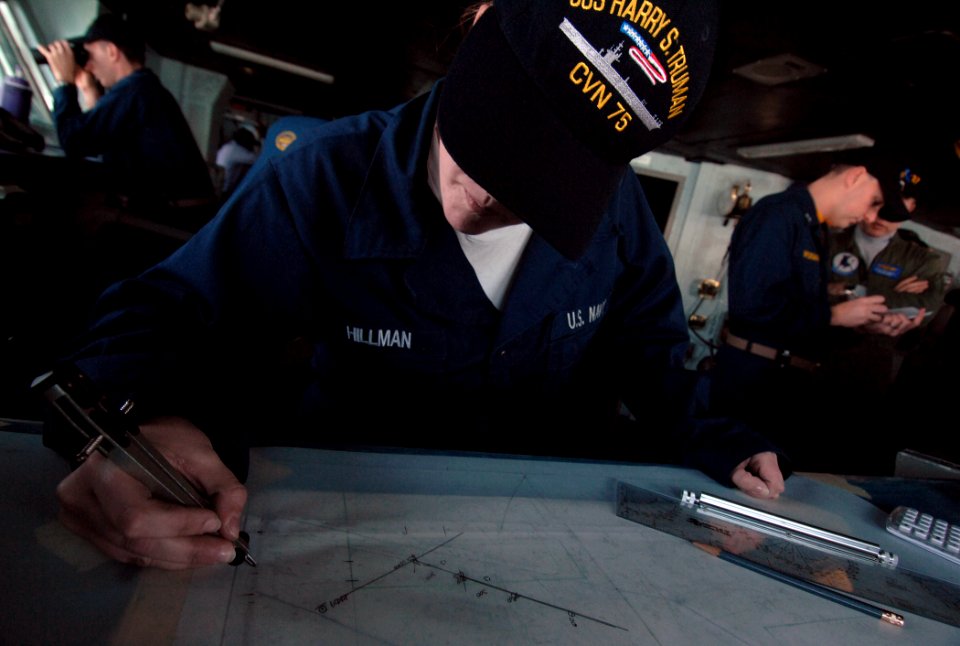 US Navy 080209-N-8923M-021 Quartermaster Seaman Jenifer Hillman plots the course of the Nimitz-class aircraft carrier USS Harry S. Truman (CVN 75) during an underway replenishment