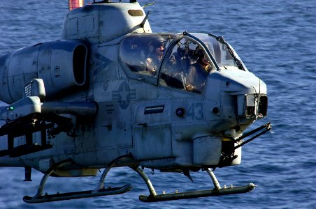 US Navy 080212-N-8335D-184 Capt. Vincent K. Dixon, left, and 1st Lt. Andrew C. Robbins of Marine Medium Helicopter Squadron Reinforced (HMM (REIN)) 166 land their AH-1W Super Cobra on the amphibious assault ship USS Tarawa (LHA