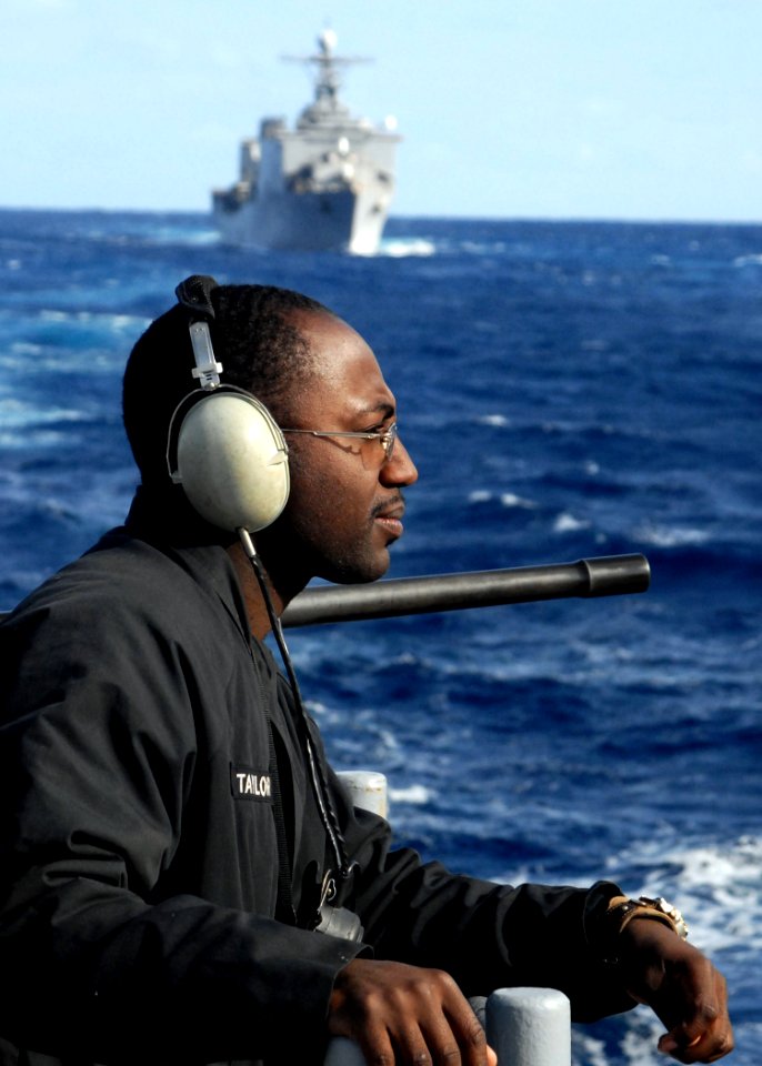 US Navy 080214-N-5067K-393 Seaman Kevin Taylor, the aft lookout for the amphibious transport dock USS Juneau (LPD 10) monitors the fleet replenishment oiler USNS Pecos (T-AO-197), not pictured, during an underway replenishment