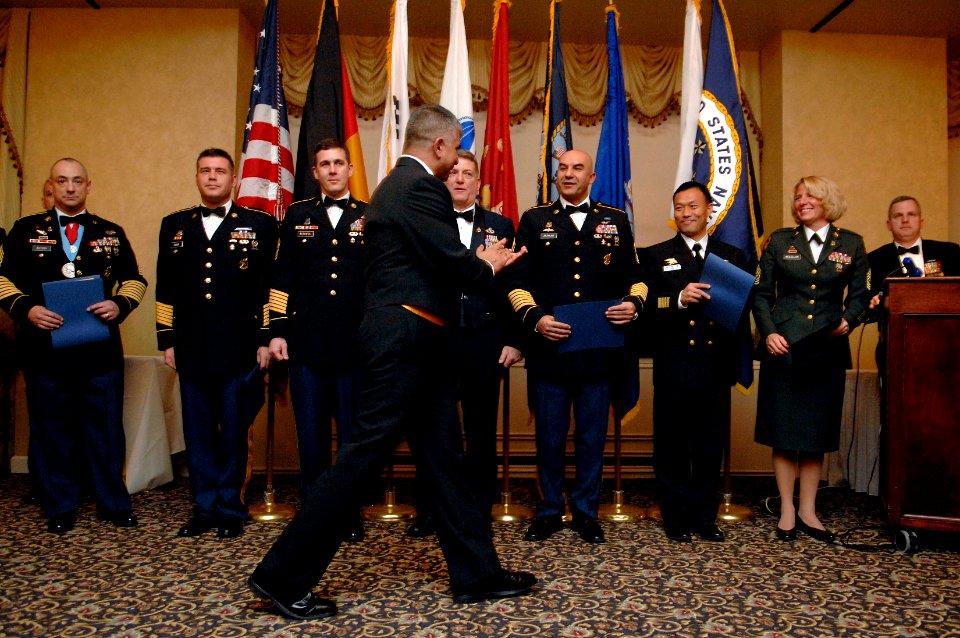 US Navy 080214-N-9818V-392 Master Chief Petty Officer of the Navy (MCPON) Joe R. Campa Jr. congratulations students of the Senior Enlisted Academy (SEA) who were named honorary chief petty officers during their graduation cerem