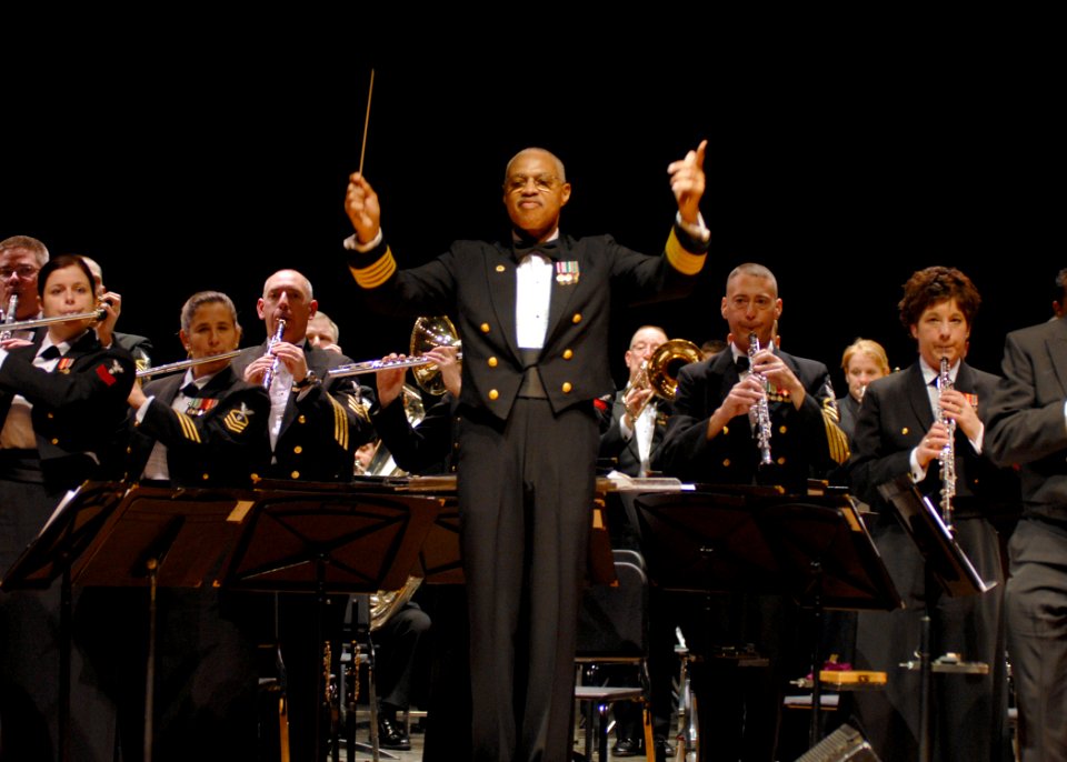 US Navy 080211-N-0773H-077 Commanding Officer-leader of the United States Navy Band, Capt. George N. Thompson, leads the audience in the