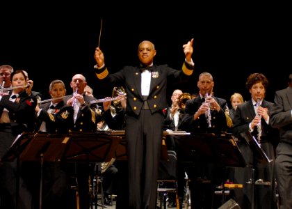 US Navy 080211-N-0773H-077 Commanding Officer-leader of the United States Navy Band, Capt. George N. Thompson, leads the audience in the