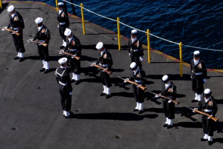 US Navy 080211-N-0640K-002 The color-guard aboard the Nimitz-class aircraft carrier USS Ronald Reagan (CVN 76) participates in a burial-at-sea ceremony for nine military veterans photo