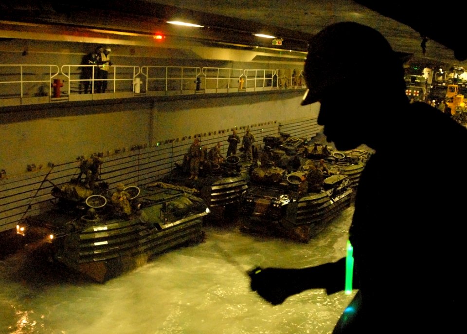 US Navy 080211-N-5067K-096 Chief Boatswain's Mate Alan N. Daniel directs the recovery of amphibious assault vehiclesin the well deck of USS Juneau (LPD 10)