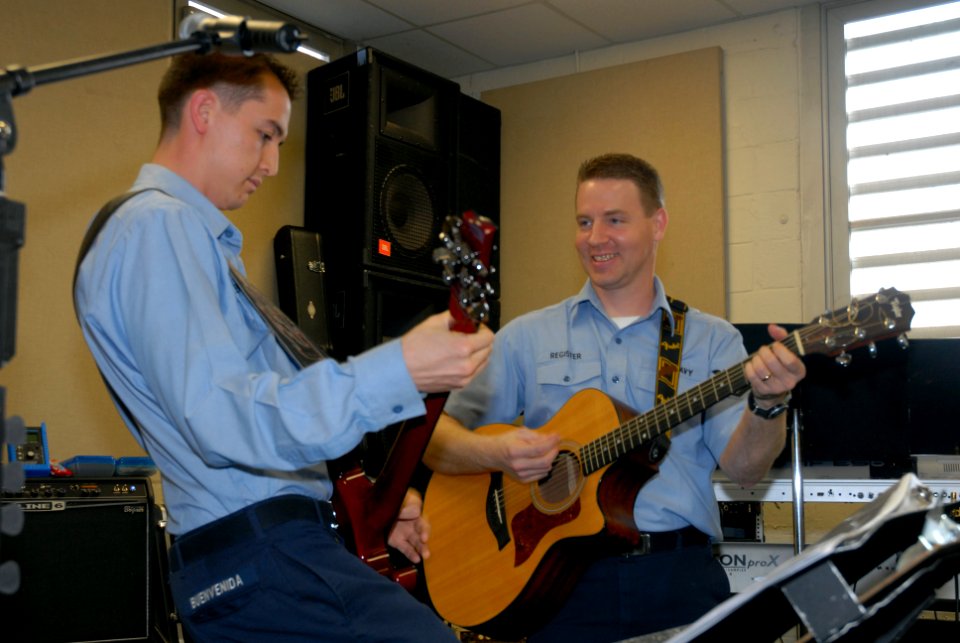 US Navy 080207-N-8102J-001 Musician 3rd Class Michael Buenvenida and Musician 3rd Class Gene Register, guitarist for the rock band