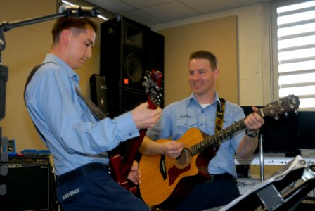 US Navy 080207-N-8102J-001 Musician 3rd Class Michael Buenvenida and Musician 3rd Class Gene Register, guitarist for the rock band