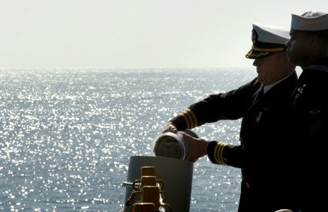 US Navy 080211-N-3659B-085 Cmdr. Lee Axtell, command chaplain aboard the Nimitz-class aircraft carrier USS Ronald Reagan (CVN 76), releases the ashes of retired U.S. Navy captain and astronaut Walter M. (Wally) Schirra