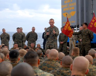 US Navy 080214-N-5067K-409 Col. John L. Mayer, commanding officer of the 31st Marine Expeditionary Unit (MEU) congratulates the Marines of 31st Marine Expeditionary Unit (31st MEU) aboard the amphibious transport dock USS Junea