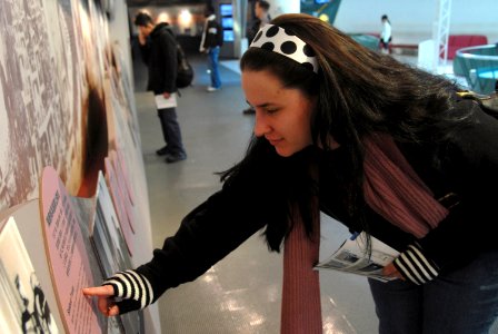 US Navy 080213-N-6326B-128 Culinary Specialist 3rd Class Catawnya Bales, assigned to the aircraft carrier USS Nimitz (CVN 68), reads a display while touring the grounds of the Nagasaki Atomic Bomb Museum during a port visit to photo