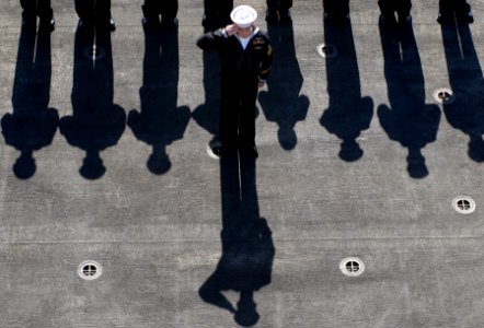 US Navy 080211-N-0640K-015 A Sailor aboard the Nimitz-class aircraft carrier USS Ronald Reagan (CVN 76) renders a hand salute during a burial-at-sea ceremony for nine military veterans
