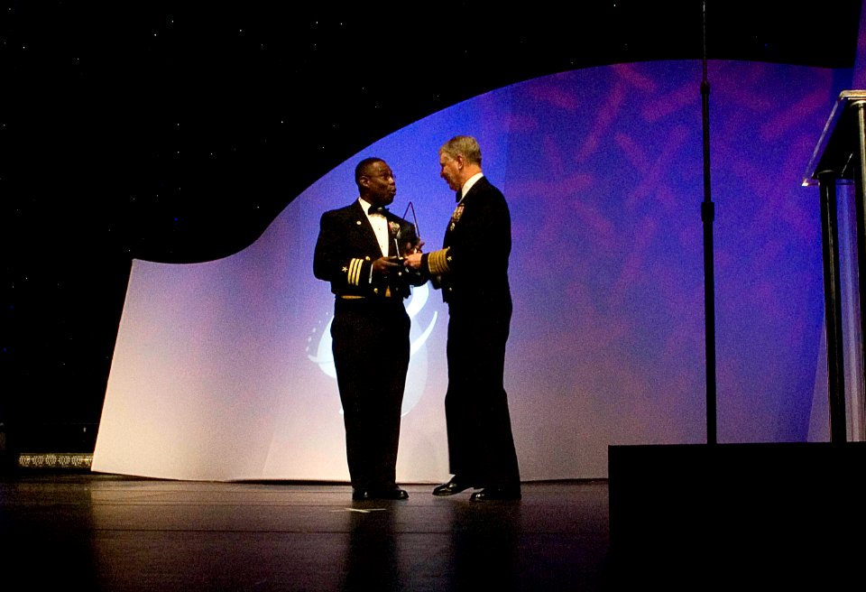 US Navy 080216-N-8273J-179 Chief of Naval Operations (CNO) Adm. Gary Roughead presents the Black Engineer of the Year for Career Achievement in Government to Cdr. Richard Bryant during the 2008 Black Engineer of the Year Awards