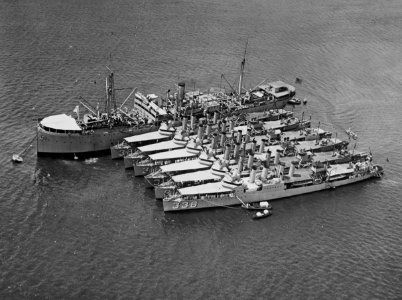 USS Altair (AD-11) moored in Pearl Harbor with destroyers on 8 February 1925