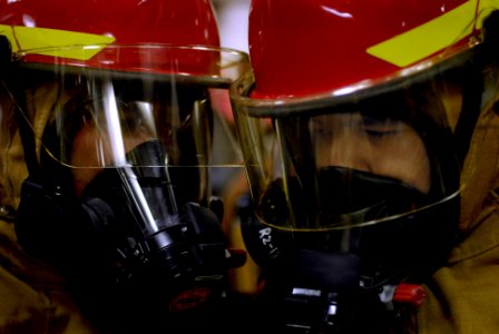US Navy 080212-N-8546L-120 Machinist Mate 3rd Class Ronald Dumale and Hull Technician Fireman Ricardo Sotomagdaleno communicate via voice amplifiers
