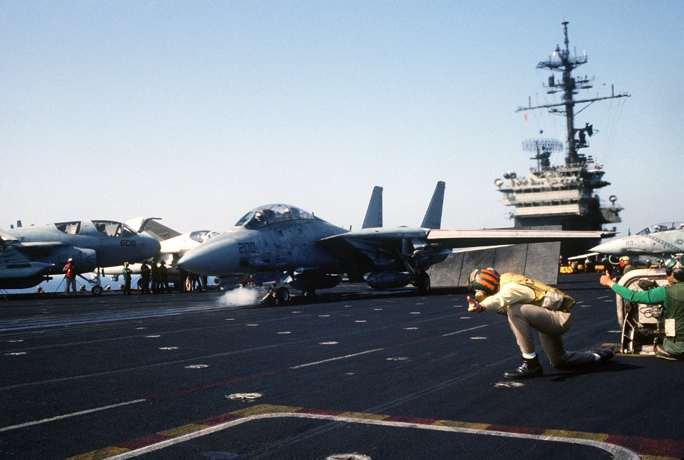 USS America (CV-66) prepares to launch F-14 Tomcat off coast of Libya 1986