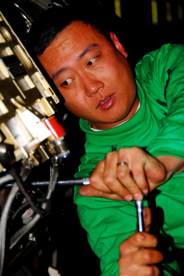 US Navy 080216-N-9760Z-004 Aviation Machinist's Mate 2nd Class Charles Wang, assigned to the