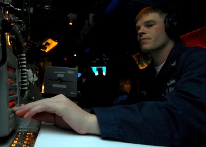 US Navy 080216-N-5476H-027 Fire Controlman 2nd Class John Whitby, from San Leandro, Calif., operates the radar system control in the combat information center during a ballistic missile defense drill aboard the Ticonderoga-clas