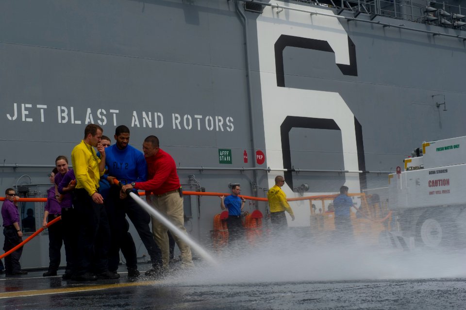 USS America deck scrubbing 140911-N-MZ309-041