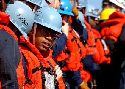 US Navy 080214-N-0807W-269 Storekeeper Seaman Kirt Q. Hicks waits with other members of the replenishment team aboard the dock landing ship USS Harpers Ferry (LSD 49)