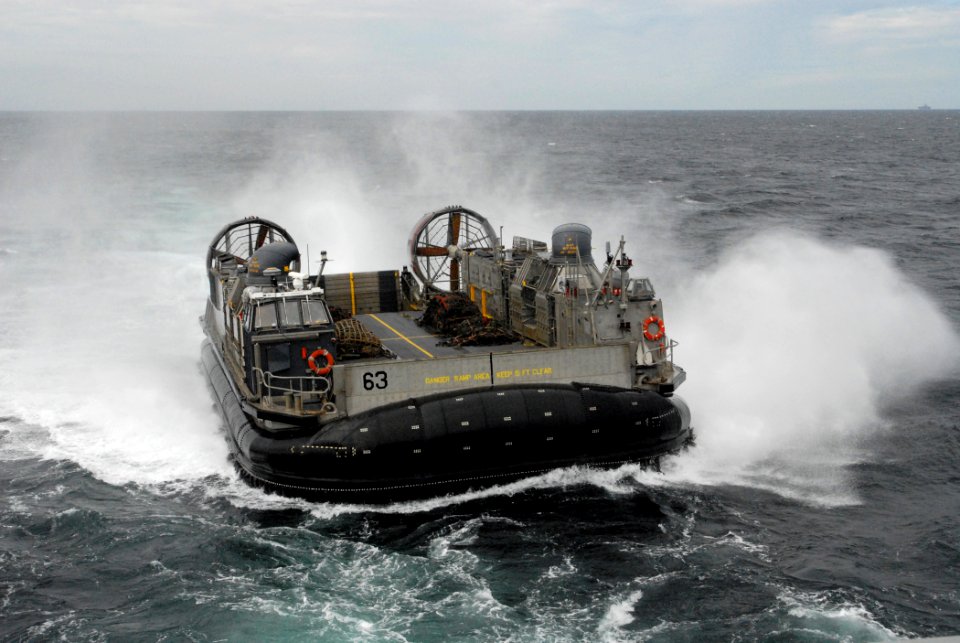 US Navy 080219-N-5067K-027 A landing craft air cushion from Assault Craft Unit (ACU) 5 approaches the well deck of the amphibious transport dock ship USS Juneau (LPD 10)