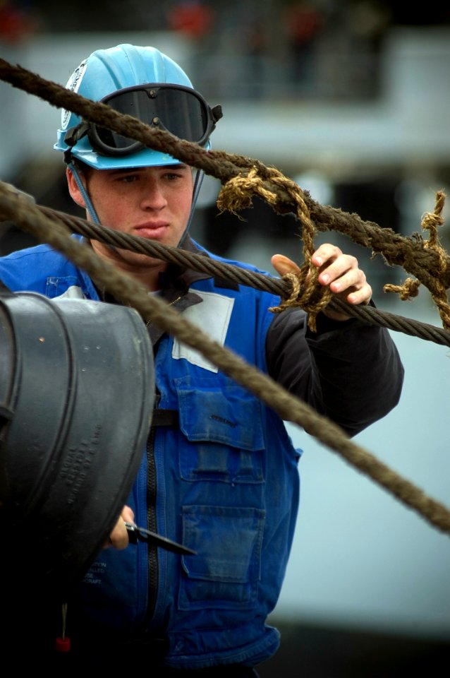 US Navy 080218-N-5253W-001 Seaman Harrison Shelton works on a messenger line from the Military Sealift Command fleet replenishment oiler USNS Rappahannock (T-AO 204) during a refueling at sea