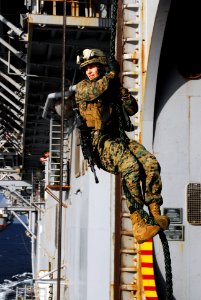 US Navy 080215-N-0120A-056 A Marine from the 31st Marine Expeditionary Unit (MEU) practices fast roping aboard the forward-deployed amphibious assault ship USS Essex (LHD 2) photo