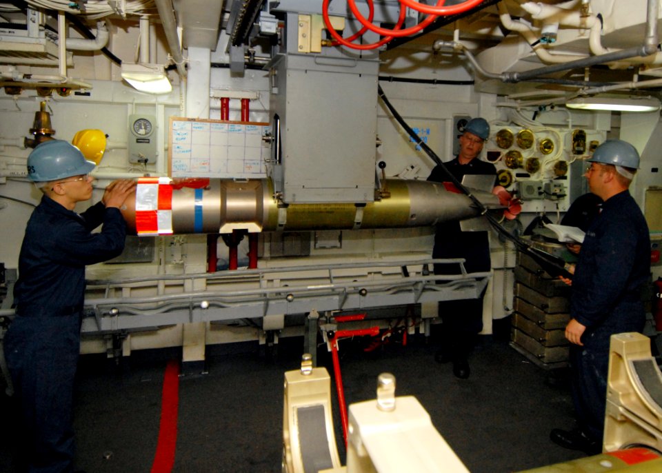 US Navy 080217-N-5476H-020 The torpedo handling team removes a MK46 Torpedo from the loading tray during a torpedo loading and unloading exercise aboard the guided missile cruiser USS Lake Erie (CG 70)